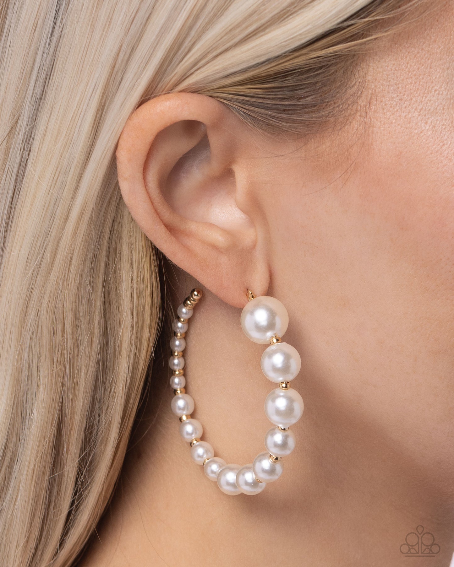 Refined hoop pearl earrings with alternating glossy white pearls and dainty gold beads, gradually decreasing in size.