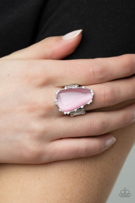 Paparazzi Jewelry Newport Nouveau - Pink Ring A Finishing Touch Jewelry A tranquil asymmetrical pink cat's eye stone is encased in a delicately dotted shimmery silver frame.Features a stretchy band for a flexible fit. Sold as one individual ring.